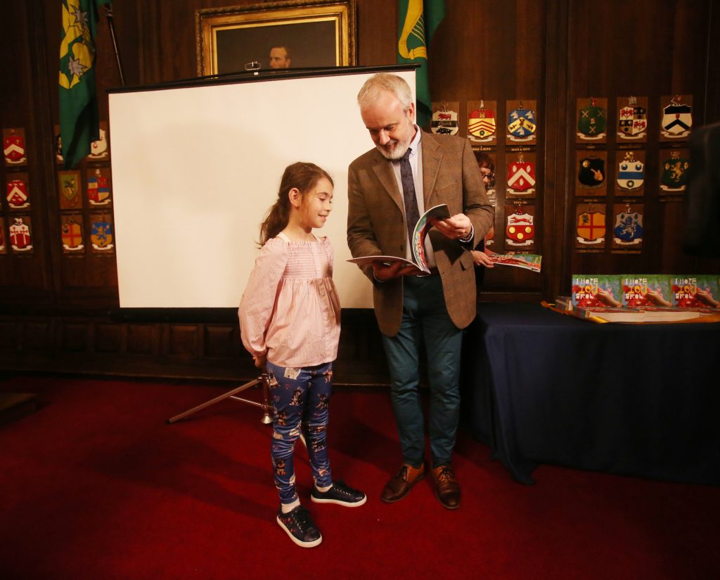 Image of Colm O’Corman with a young writer and artist from I Hope You Grow. Photo copyright Leon Farrell, Photocall Ireland.