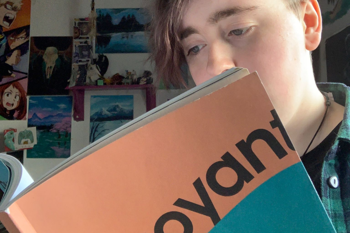 Young writer with a copy of Buoyant